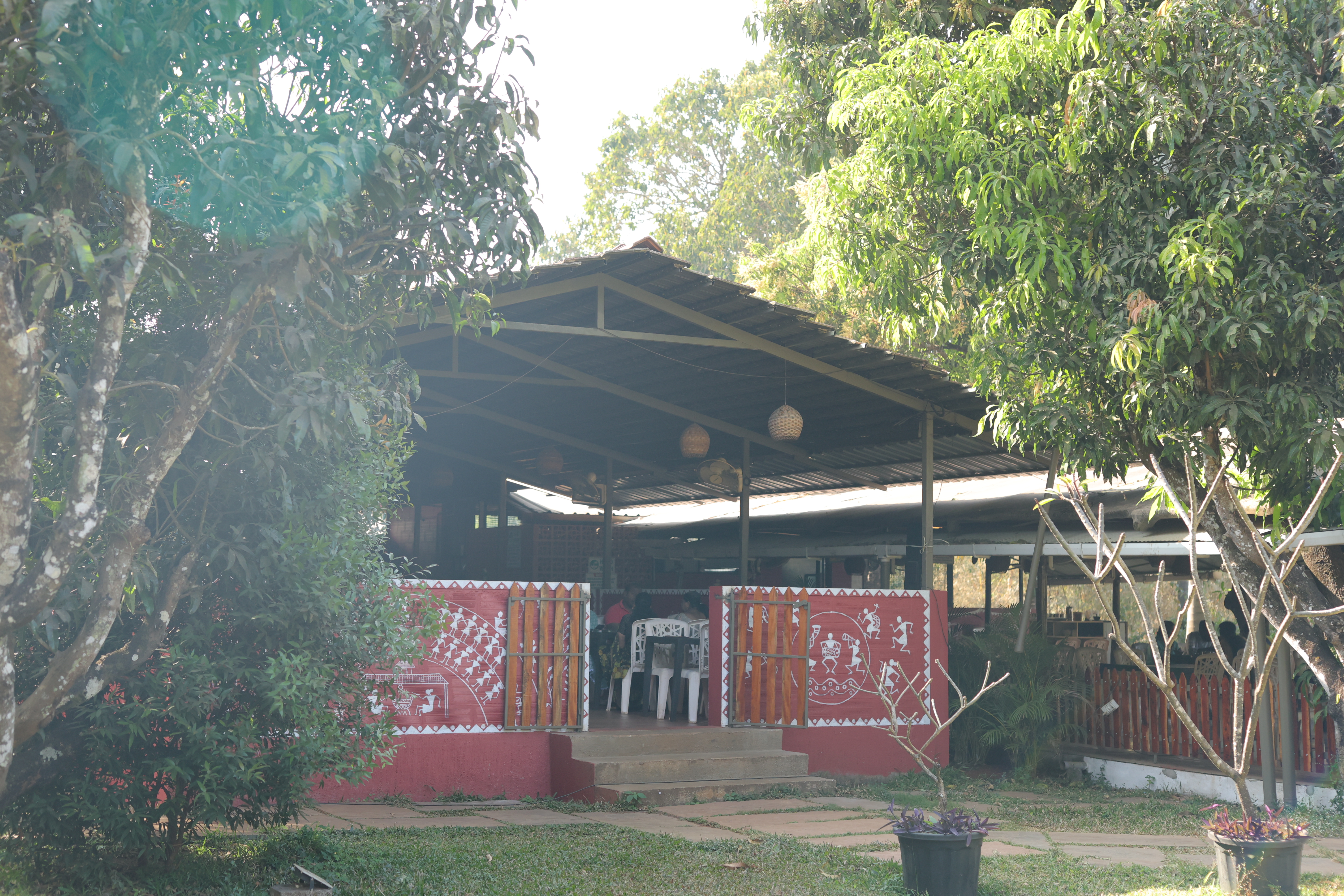 Jatra Countryside restaurant exterior surrounded by lush trees