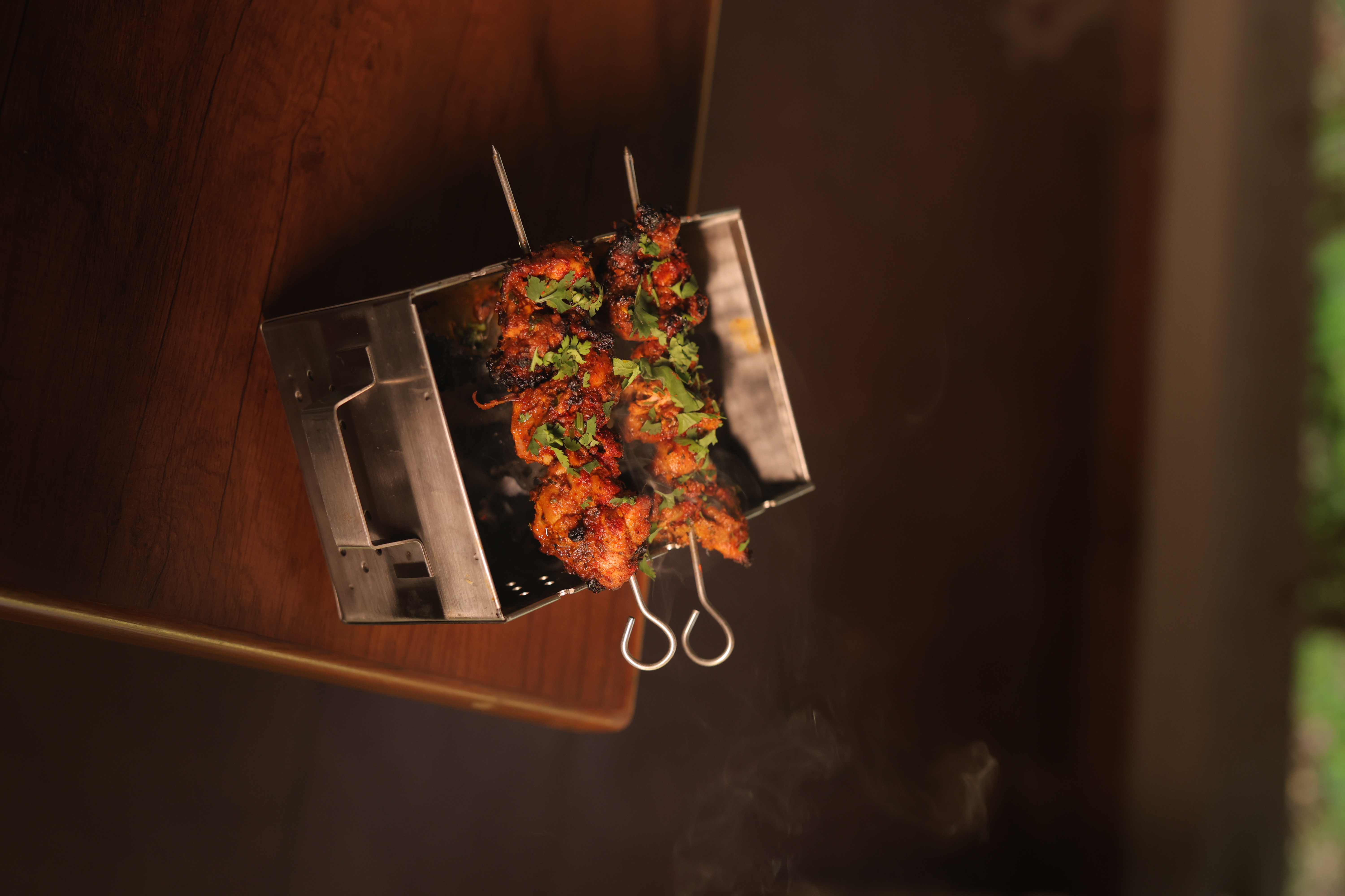 Overhead view of succulent chicken tikka with cilantro at Jatra Countryside