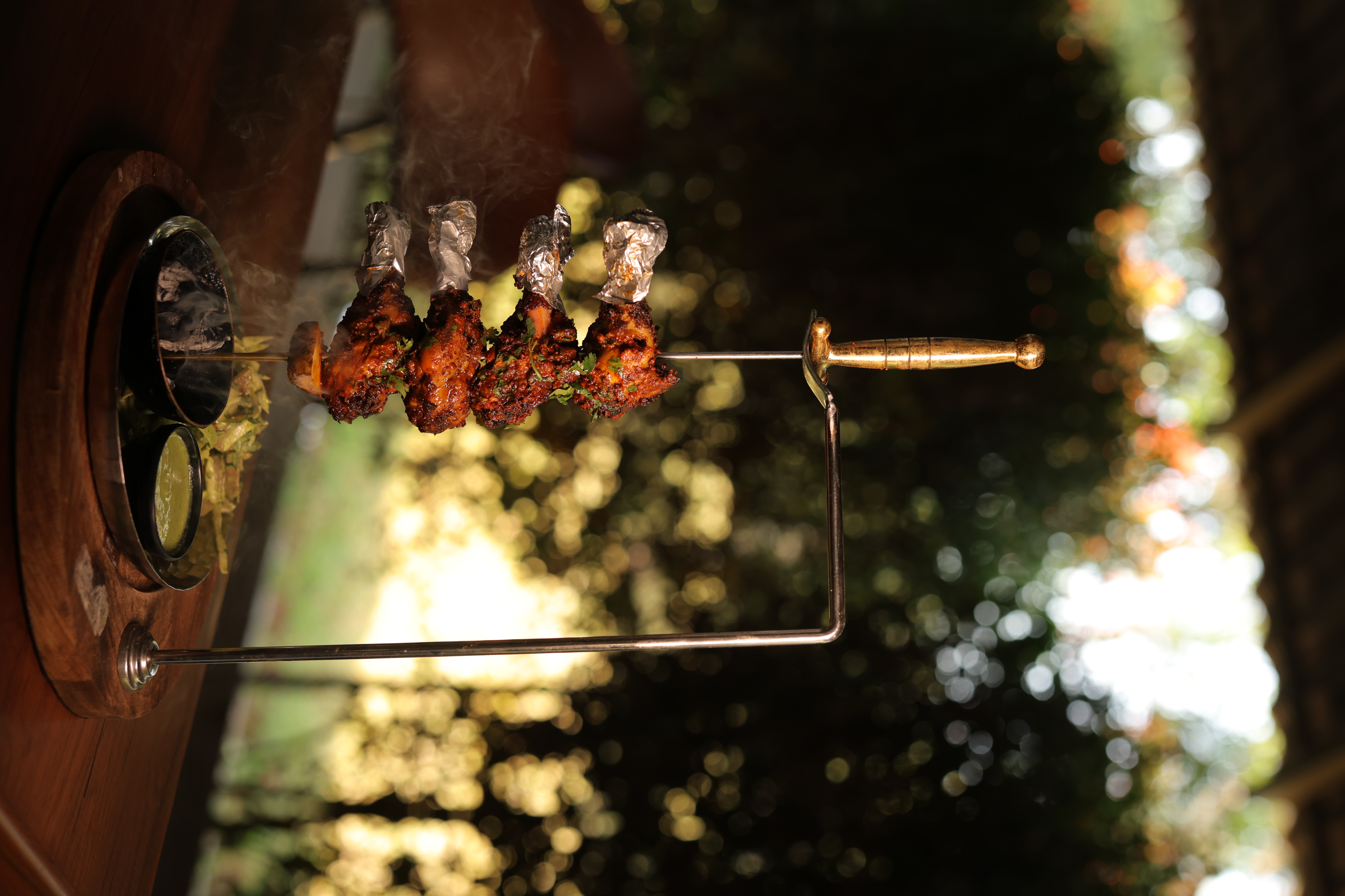 Seasonal tandoori skewer with smoky autumn background at Jatra Countryside